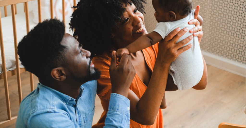 A co-parenting planner and baby essentials like a diaper bag, white noise machine, and baby monitor.